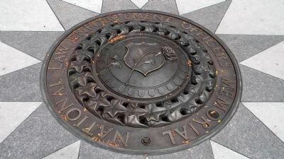 <i>Panel 2</i>: - the Seal of the National Law Enforcement Officers Memorial Fund.. Click for full size. <i>Panel 2</i>: - the Seal of the National Law Enforcement Officers Memorial Fund. image. Click for full size.
