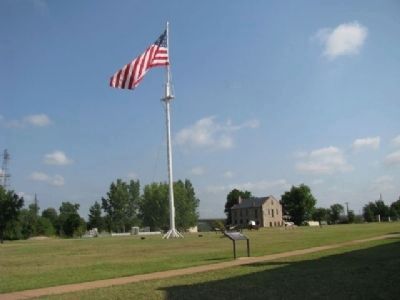 Fort Smith parade grounds and historic commissary storehouse image. Click for full size.