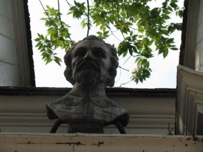 A bust above the main doorway of The Raleigh Tavern. image. Click for full size.