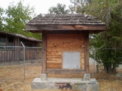 Old French Trail Marker with Fresno Flats building in background. Click for full size. Old French Trail Marker with Fresno Flats building in background image. Click for full size.