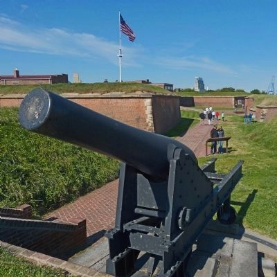 Tourists read the Outer Battery Marker with an 8-inch Roman gun in the foreground image. Click for full size.