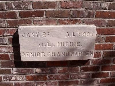 A cornerstone from an earlier courthouse on the site image. Click for full size.