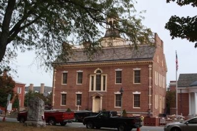 The Delaware Line Marker (at left) opposite the Old State House image. Click for full size.