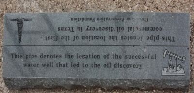 This pipe denotes the location of the successful water well that led to the oil discovery. Click for full size. This pipe denotes the location of the successful water well that led to the oil discovery image. Click for full size.