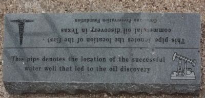 This pipe denotes the location of the successful water well that led to the oil discovery image. Click for full size.