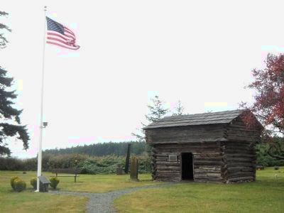 View of the Davis Blockhouse from the Remaining Blockhouses of Central Whidbey Marker image. Click for full size.