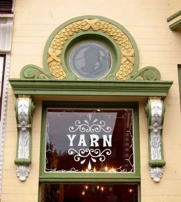 Decorative element above the shop window image. Click for full size.