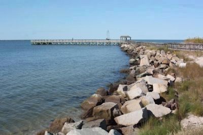 Riprap jetty, as mentioned, and present day public fishing pier, overlooking the Chesapeake Bay. image. Click for full size.