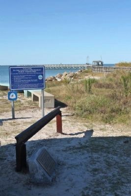 Marker, rail, and the riprap jetty. Click for full size. Marker, rail, and the riprap jetty image. Click for full size.