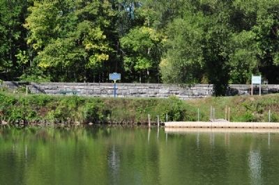 Erie Lock 60 Marker as seen across the Erie Canal from the Towpath Walking Trail. Click for full size. Erie Lock 60 Marker as seen across the Erie Canal from the Towpath Walking Trail image. Click for full size.
