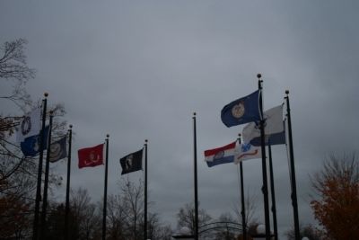 Various flags at memorial image. Click for full size.