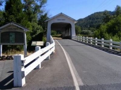 Grave Creek Covered Bridge and Grave Creek Ranch Marker. Click for full size. Grave Creek Covered Bridge and Grave Creek Ranch Marker image. Click for full size.