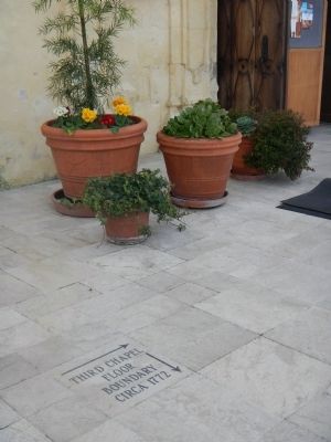Stones mark the location of several earlier chapels image. Click for full size.