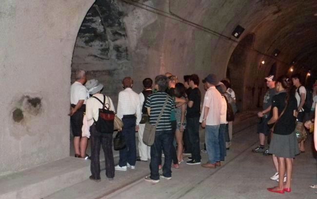 Malinta Tunnel: vistors inspecting one of the "laterals". Click for full size. Malinta Tunnel: vistors inspecting one of the "laterals" image. Click for full size.