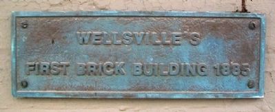 Wellsville's First Brick Building Marker image. Click for full size.