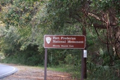 NPS sign located on Demere Road, looking north image. Click for full size.