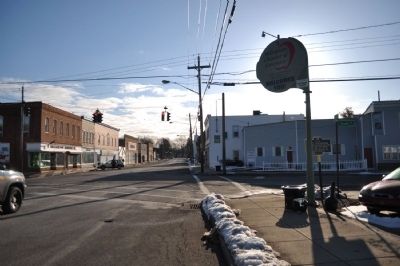 Site of First Log House Marker as seen facing East on Ridge/Main. Click for full size. Site of First Log House Marker as seen facing East on Ridge/Main image. Click for full size.