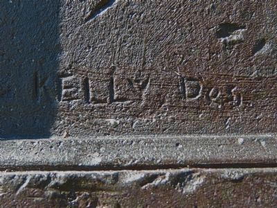 Kelly, Des. (Signature on Plaque) image. Click for full size.