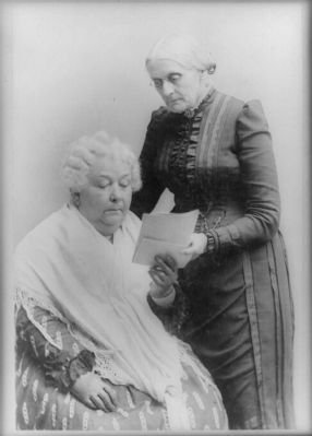 <i>Elizabeth Cady Stanton, seated, and Susan B. Anthony, standing </i> image. Click for full size.