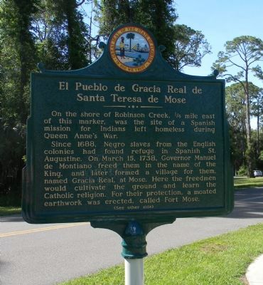 El Pueblo de Gracia Real de Santa Teresa de Mose Marker (obverse). Click for full size. El Pueblo de Gracia Real de Santa Teresa de Mose Marker (obverse) image. Click for full size.