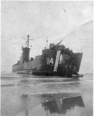 USS LSM-114 beached at Wakayama, Japan after off loading equipment for the occupation image. Click for full size.