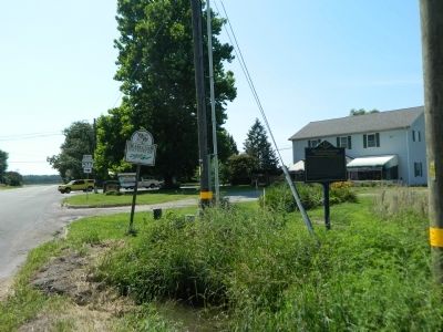 Behind this marker at the crossroads is another marker for the Patty Cannon House. image. Click for full size.