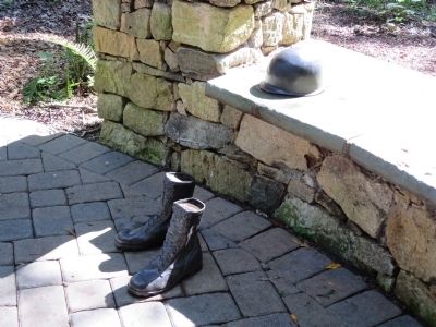 Helmet & Boots - part of the memorial plaza. Click for full size. Helmet & Boots - part of the memorial plaza image. Click for full size.