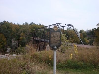 1908 Palisades Bridge Marker with Bridge in Background image. Click for full size.