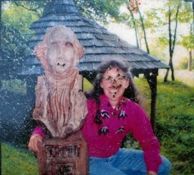 Shelly Upole<br>and her Chainsaw Carving of George Washington image. Click for full size.