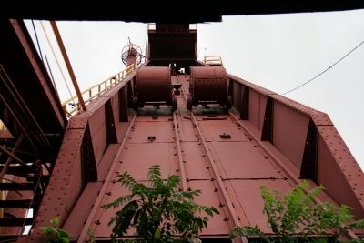 Skip hoist and skip car as seen from the skip pit.. Click for full size. Skip hoist and skip car as seen from the skip pit. image. Click for full size.