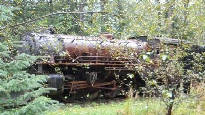 Retired Skagway and White Pass RR steam engine, side-tracked in woods near the terminal image. Click for full size.