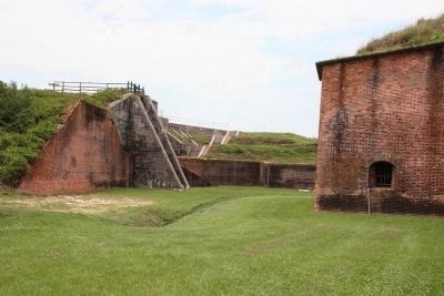 Seen here on the left how Battery Thomas is built upon the glacis of the old brick fort. image. Click for full size.