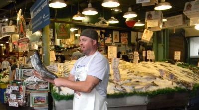 One of the famous Pike Place "Fish Guys". Click for full size. One of the famous Pike Place "Fish Guys" image. Click for full size.