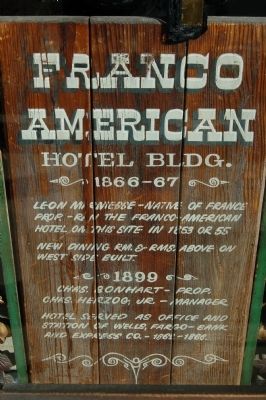Older Franco American Hotel Building Marker in Barber Shop widow. image. Click for full size.