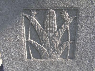 Relief carving of corn on Original Patentees Memorial Marker image. Click for full size.
