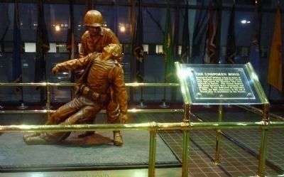 "Unspoken Bond": statue of a Navy Hospital Corpsman assisting a wounded Marine in the lobby image. Click for full size.