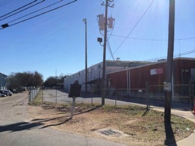 Old railroad bed between fence and building.. Click for full size. Old railroad bed between fence and building. image. Click for full size.