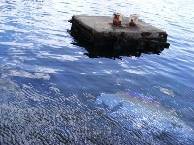 Mooring block next to the USS Arizona with the oil leaking after over 70 years image. Click for full size.