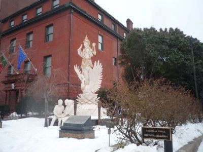 <i>Dewi Saraswati</i> statue and marker with the Embassy of Portugal in background at left, image. Click for full size.