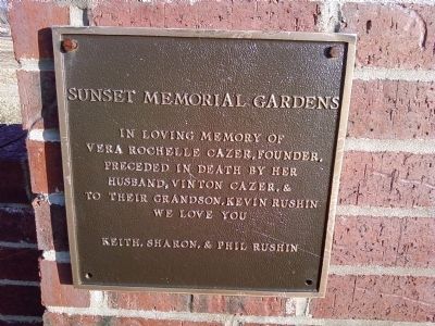 Sunset Memorial Gardens entrance gate plaque image. Click for full size.