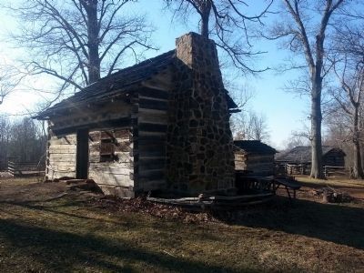 The Living Historical Farm exhibits a typical pioneer cabin. image. Click for full size.