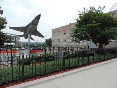 The "Fighting Falcon" on display behind the fence with the marker in view to the right image. Click for full size.
