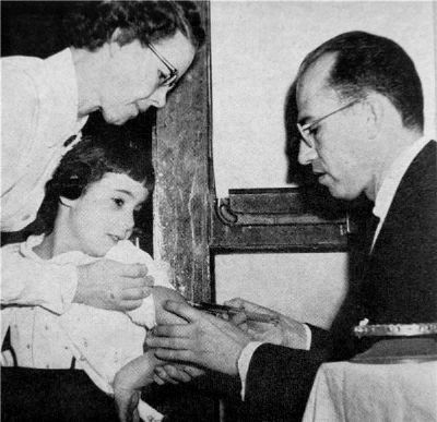 Magazine photo of Jonas Salk in laboratory image. Click for full size.