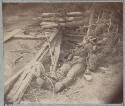 Dead Confederate soldier as he lay on the field, after the battle of the 19th May image. Click for full size.