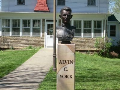Alvin C York-bust in front of house image. Click for full size.