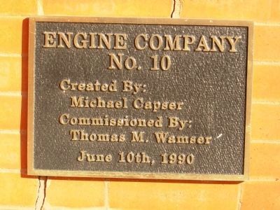 Artist's Plaque above fireman. Click for full size. Artist's Plaque above fireman image. Click for full size.