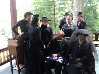 Mourners at Grant Cottage. Click for full size. Mourners at Grant Cottage image. Click for full size.