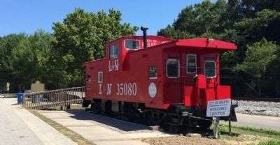 Nearby caboose & railway. image. Click for full size.