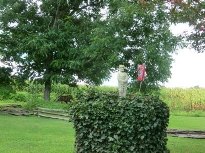 Henry M. Shaw-shrub near residence with Soldier and Confederate Flag image. Click for full size.
