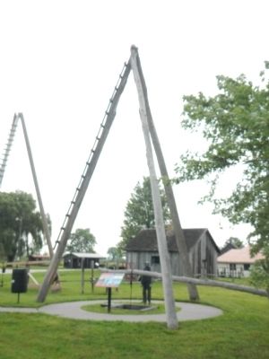 A Three-pole, spring-board oil derrick. Click for full size. A Three-pole, spring-board oil derrick image. Click for full size.